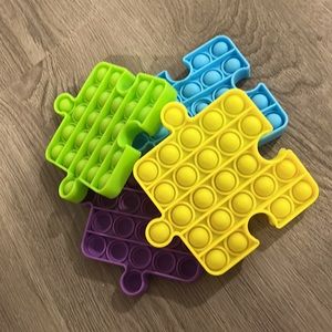 4 colorful puzzle piece pop it’s
